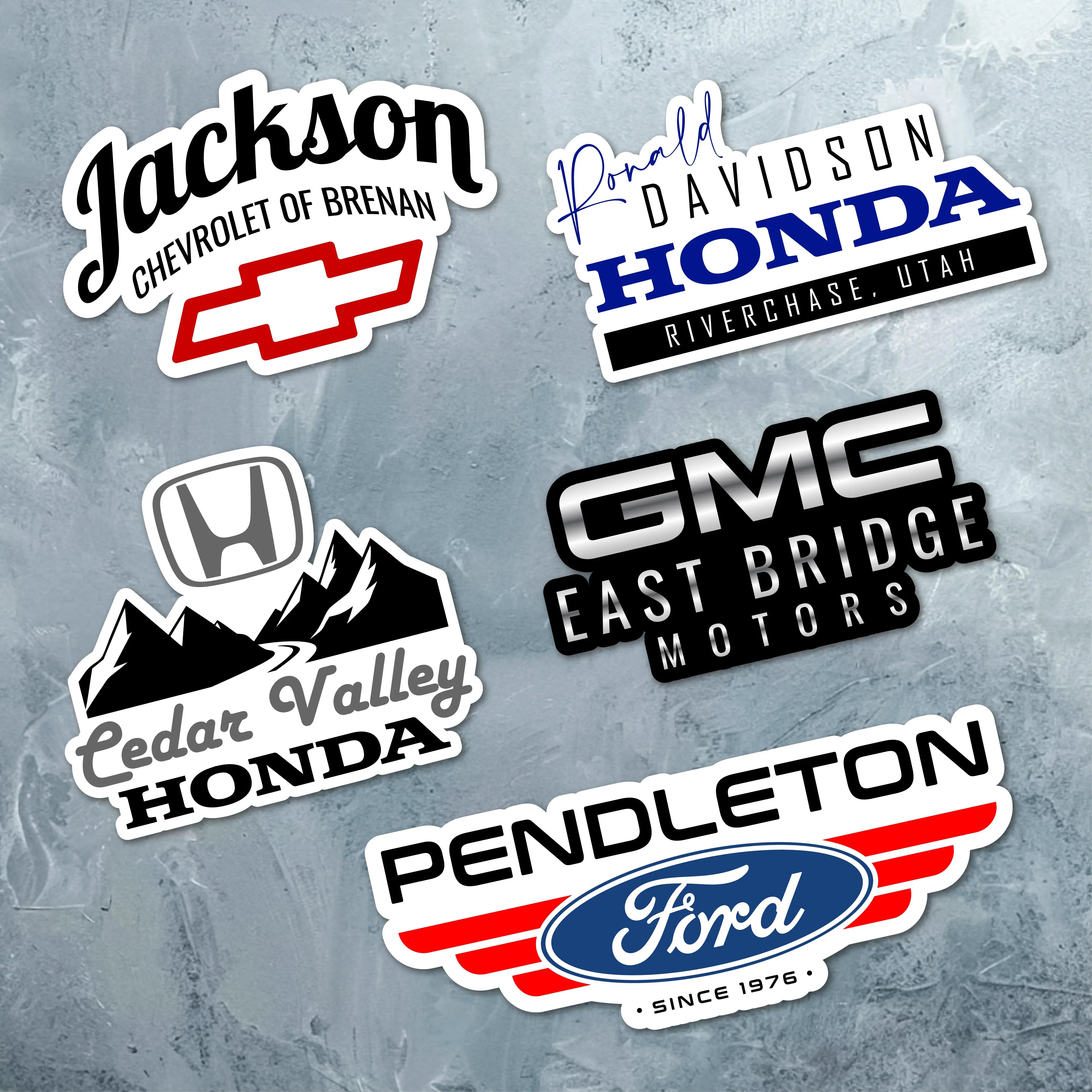 Custom car dealership stickers featuring Honda, GMC, and Ford logos for effective business promotion.