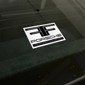 Porsche sticker on a car window highlighting quality sales and parts for car dealerships.