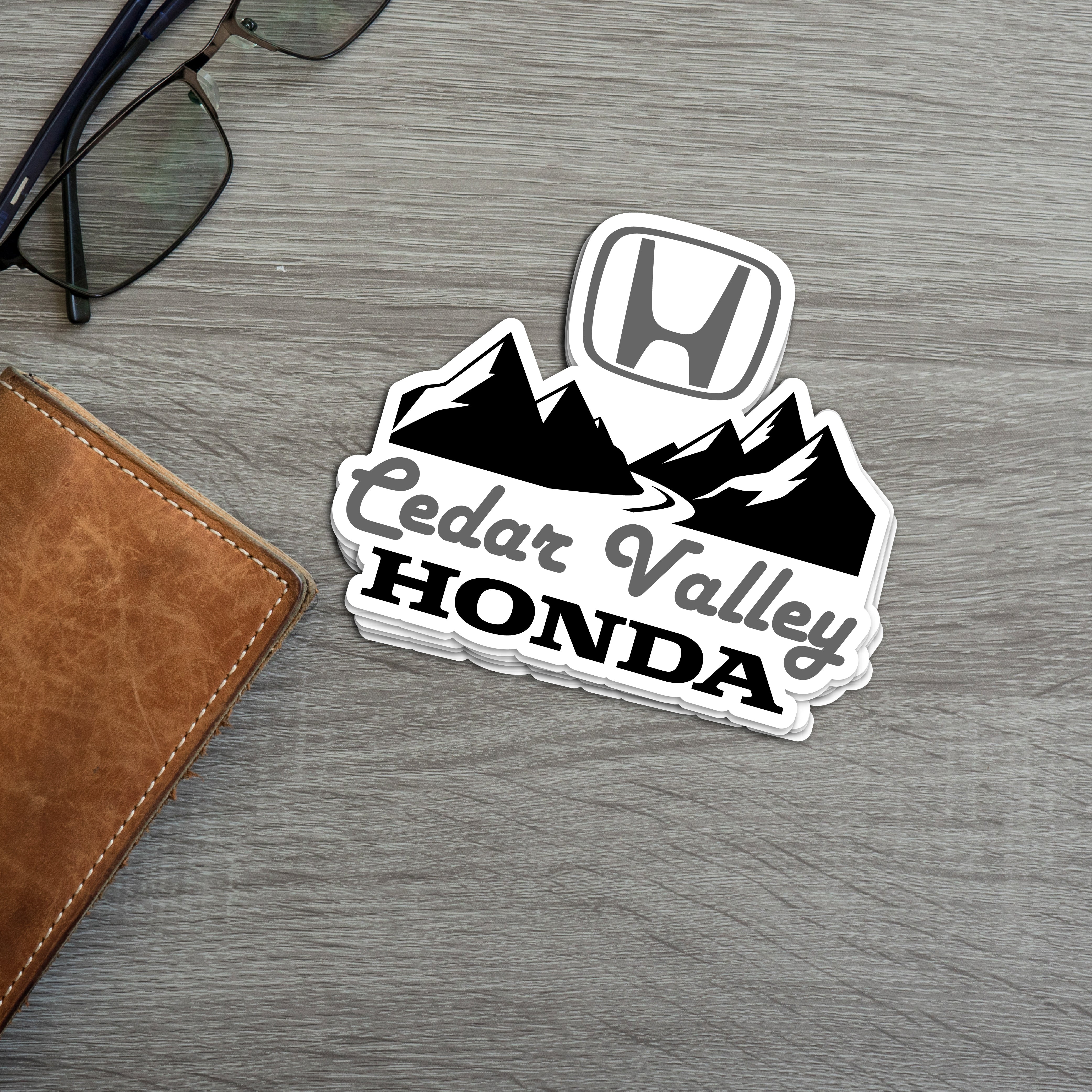 Cedar Valley Honda vinyl sticker featuring mountains and the Honda logo, ideal for car dealerships.